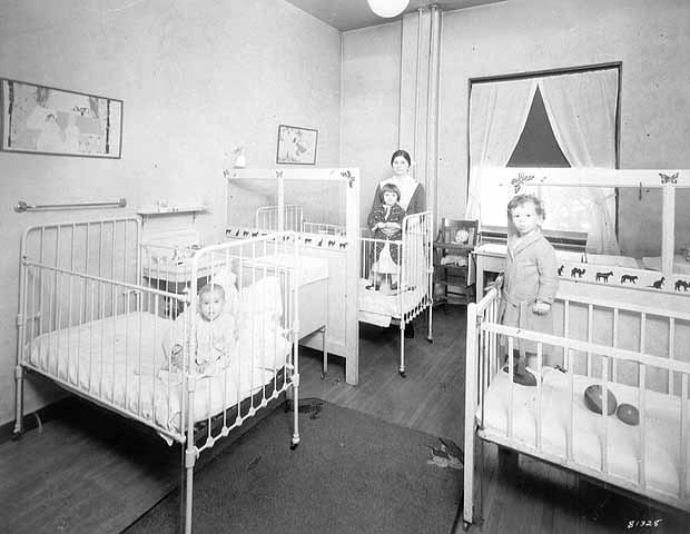 Pediatrics nurse with three young patients - 1930
